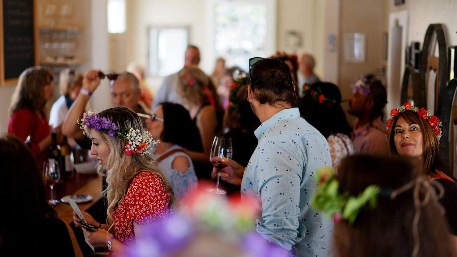 A full tasting room on a spring afternoon